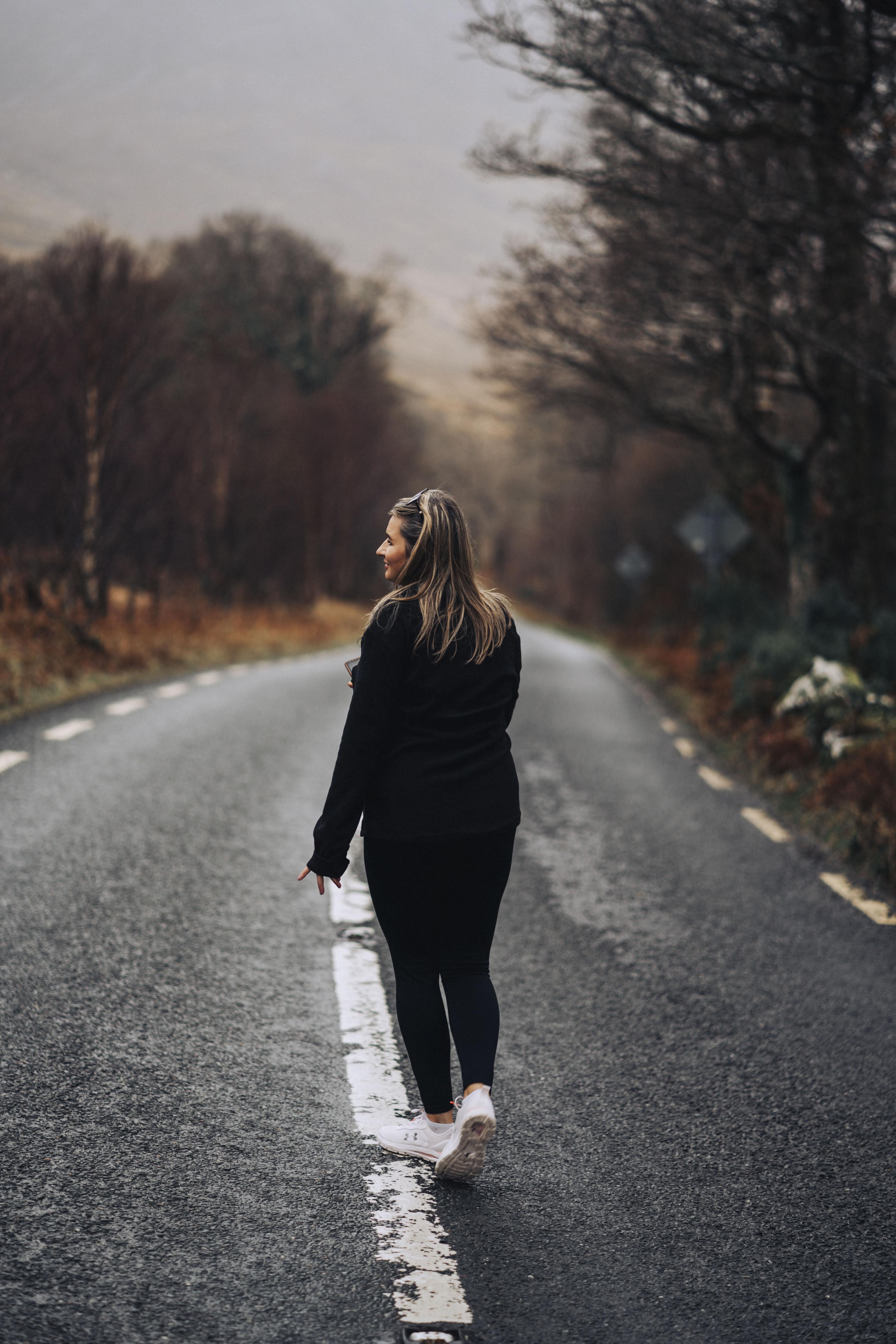 Figure on a misty road